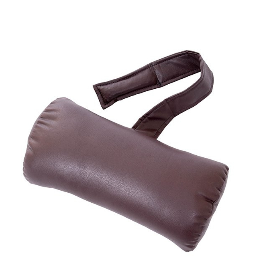 A brown, cylindrical neck pillow with a strap offers comfort and support during travel, mirroring the unmatched relaxation of the Golden Cloud+ PR511 Recliner with Lift Assist. Experience soothing 4-Zone Comfort Zone effects for a restful journey.